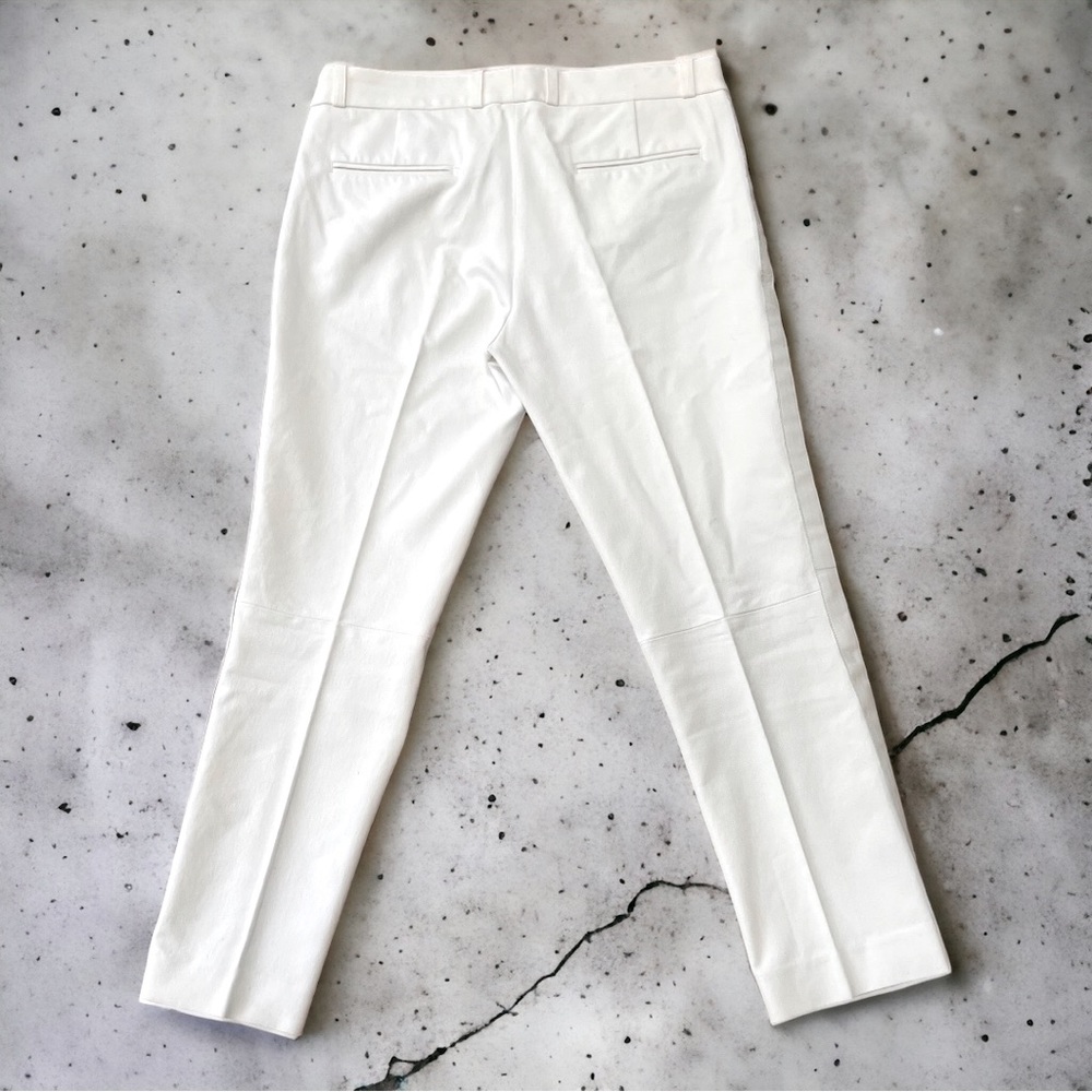 White pants with leather trim